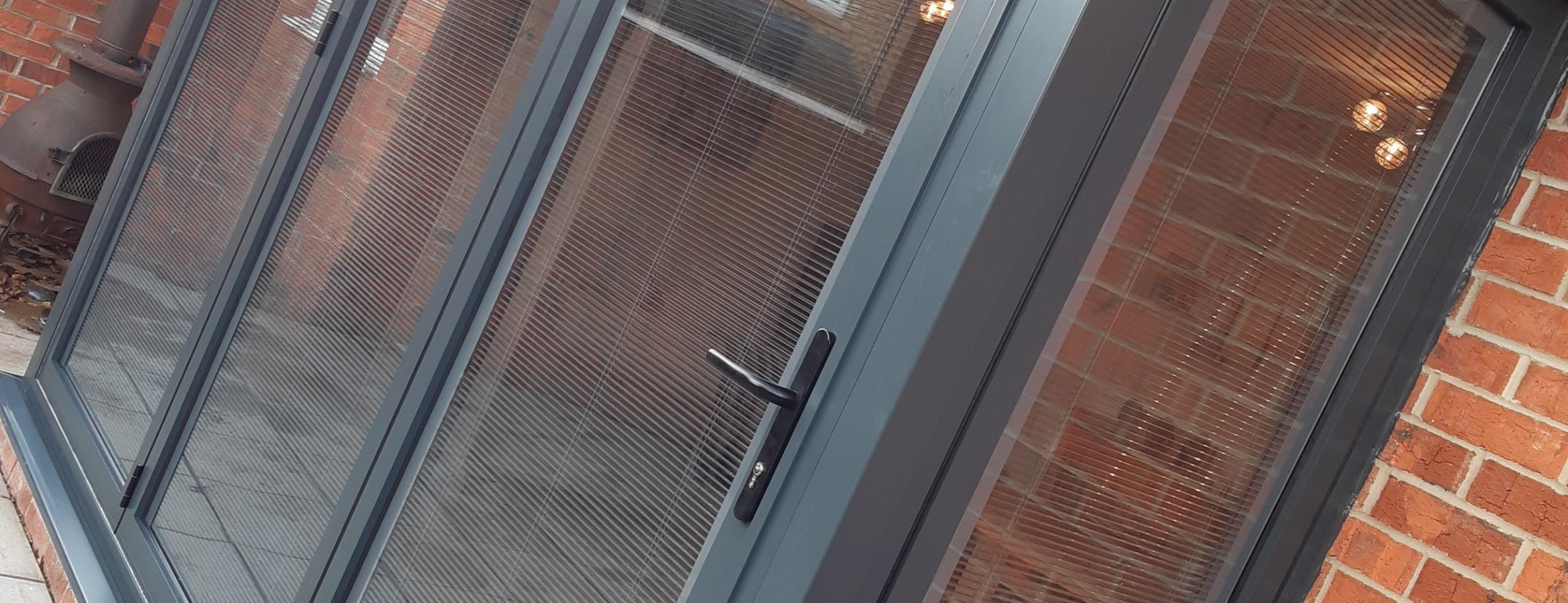 Anthracite Grey Bi folding Doors with Internal Blinds 
